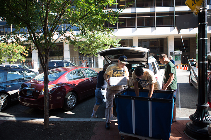 President Knapp assisting with move in