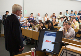 Founding Director John Rollins addresses student, faculty and alumni entrepreneurs at the 2014 GW Business Plan Competition kick