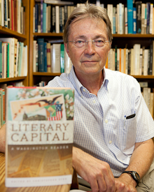 Christopher Sten sits with his book Literary Capital 