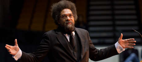 Cornel West speaking with hands held out to his side