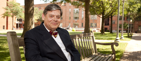 Dennis Johnson sits on a bench in University Yard