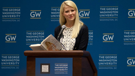 Elizabeth Smart reads from book standing in front of podium