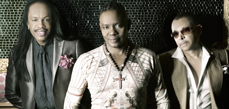 Earth Wind and Fire members stand as a group 