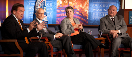 Tom Ridge, Michael Chertoff, Janet Napolitano and Admiral Thad Allen speak on stage in seated positions
