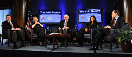 Kalb Report set with panelists sitting on stage on chairs