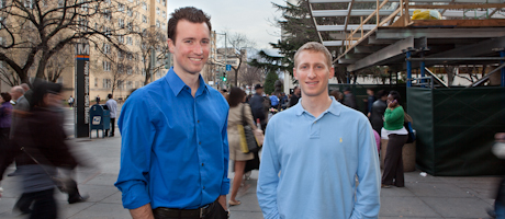 David Glidden and Andrew Thal in front of the GW Foggy Bottom Metro Station 