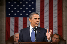 President Obama delivers the State of the Union address in U.S. Capitol with speaker and vice president seated behind him