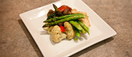 grilled vegetables including asparagus and cauliflower on plate