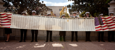 GW veterans hold banner featuring 2,000 names
