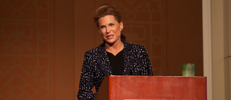 Nancy Brinker delivers keynote address at podium