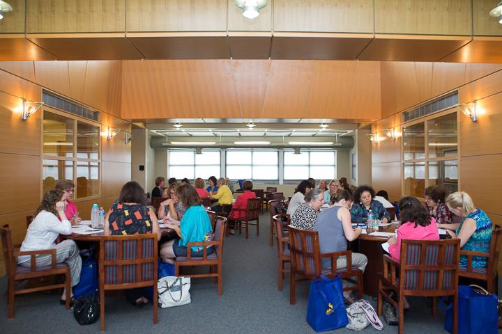 participants at circular tables seated