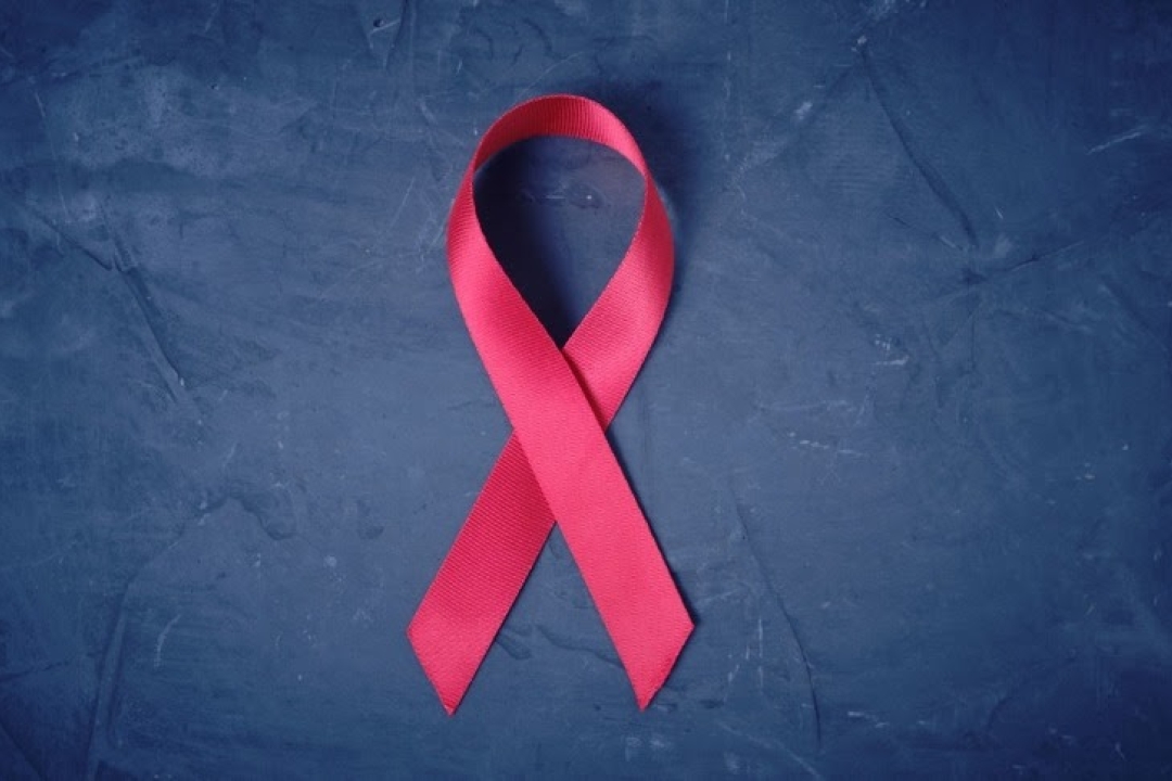AIDS ribbon on blue background