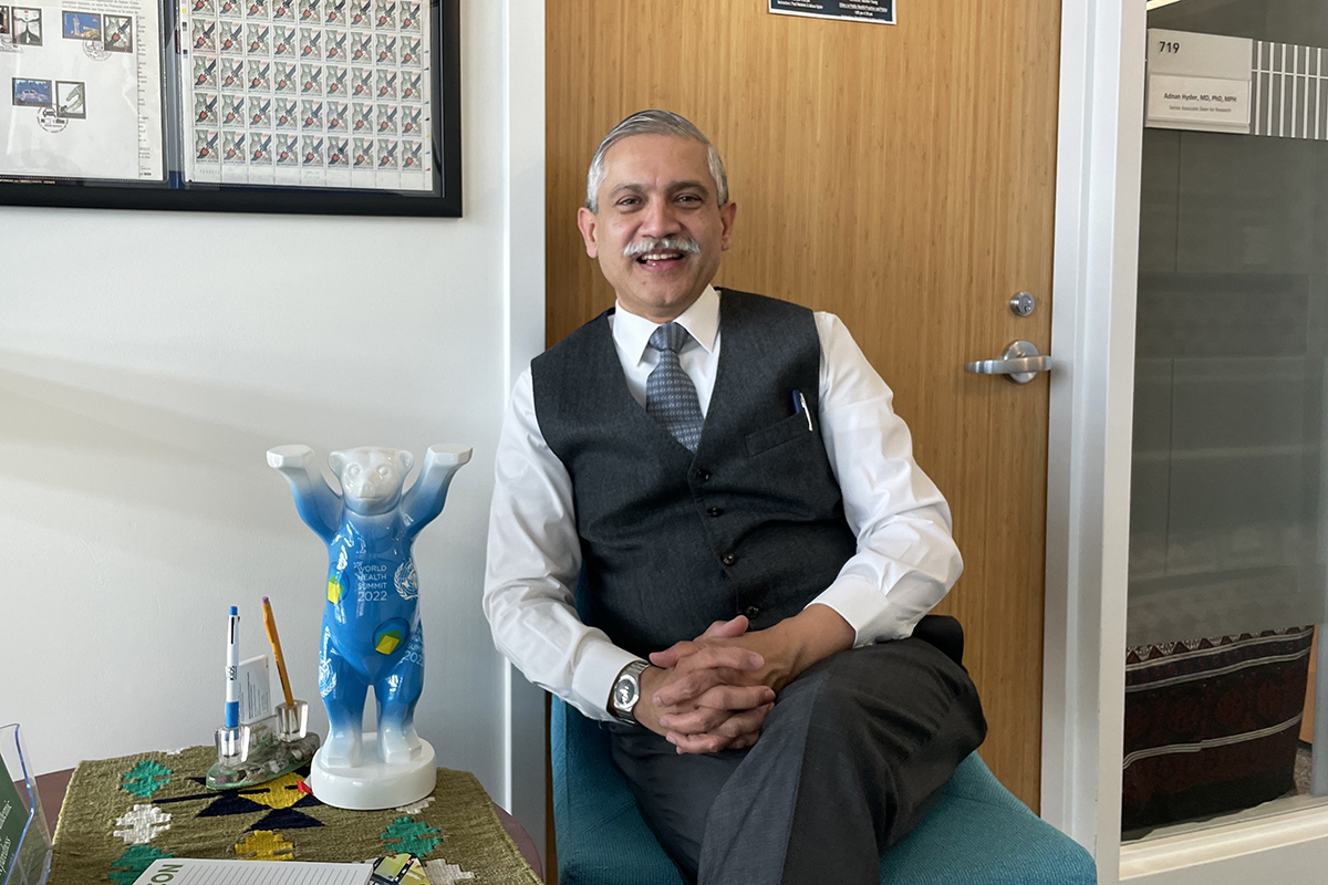 Milken Institute SPH Professor and Senior Associate Dean for Research Adnan Hyder, this year's WHS international president, with the summit's mascot, the World Health Summit Bear. (Adnan Hyder)