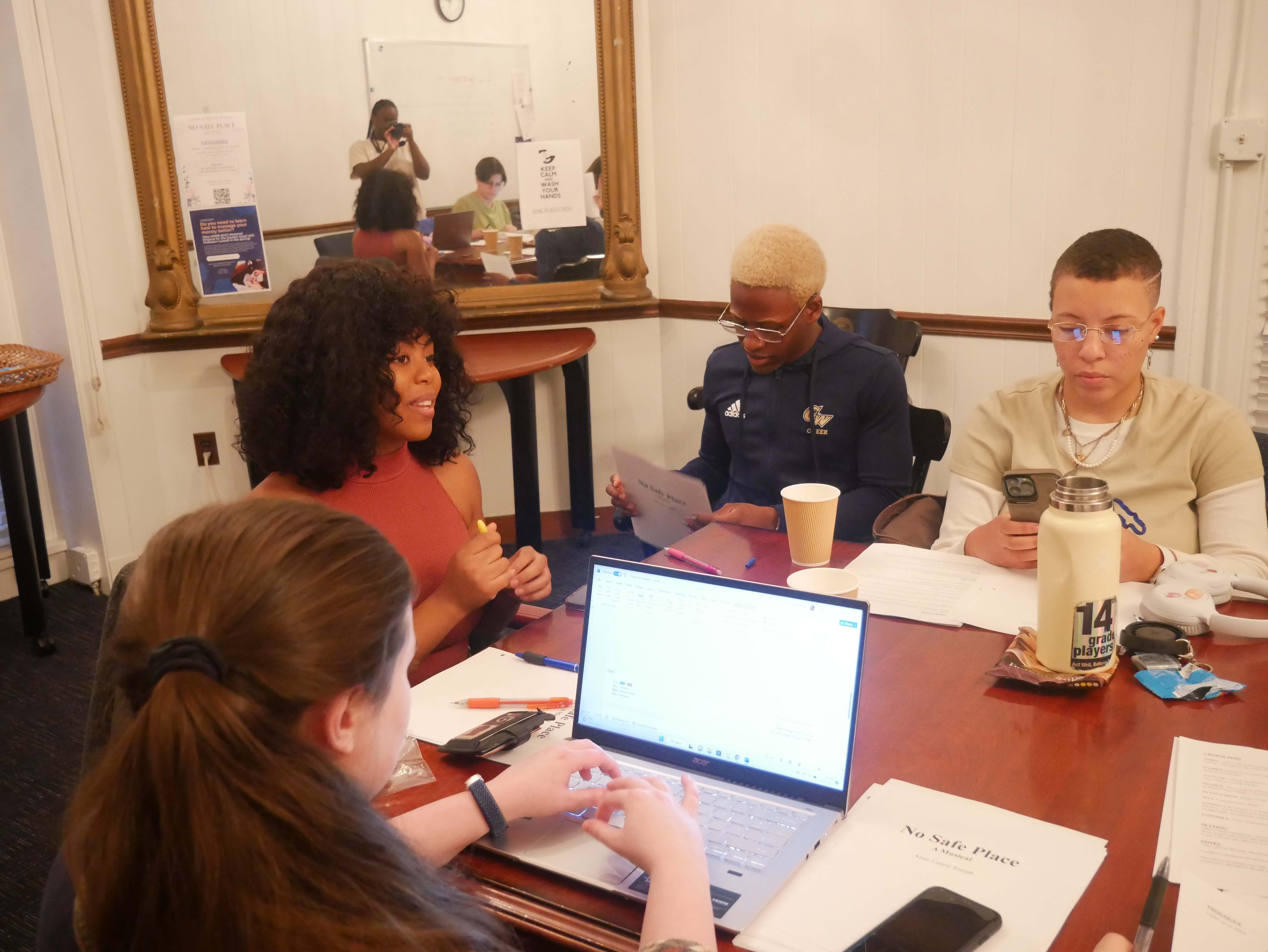 Anne Laurie Joseph with members of her show's cast and crew