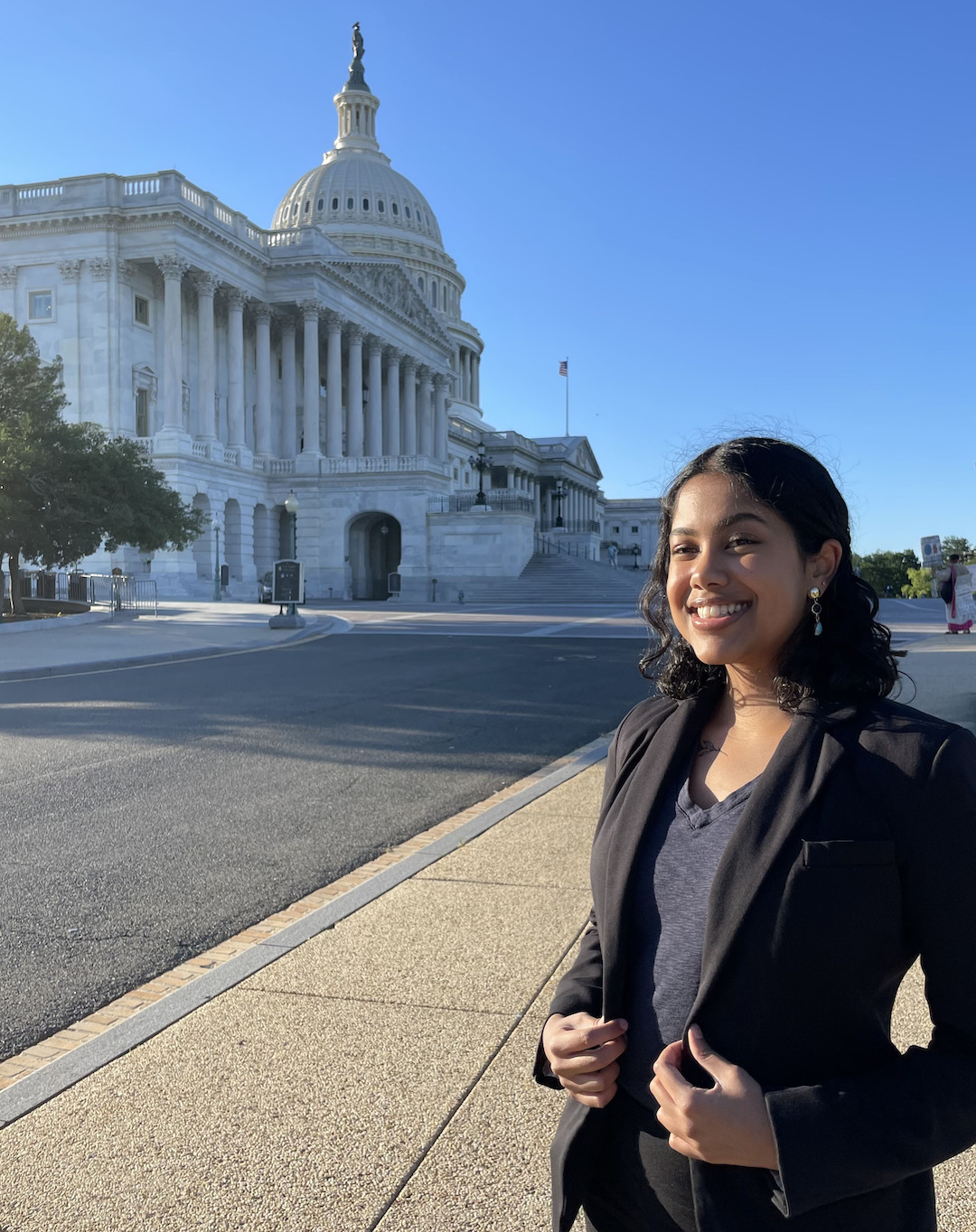 Photo of Anita Sagar in front of the U.S. Capitol
