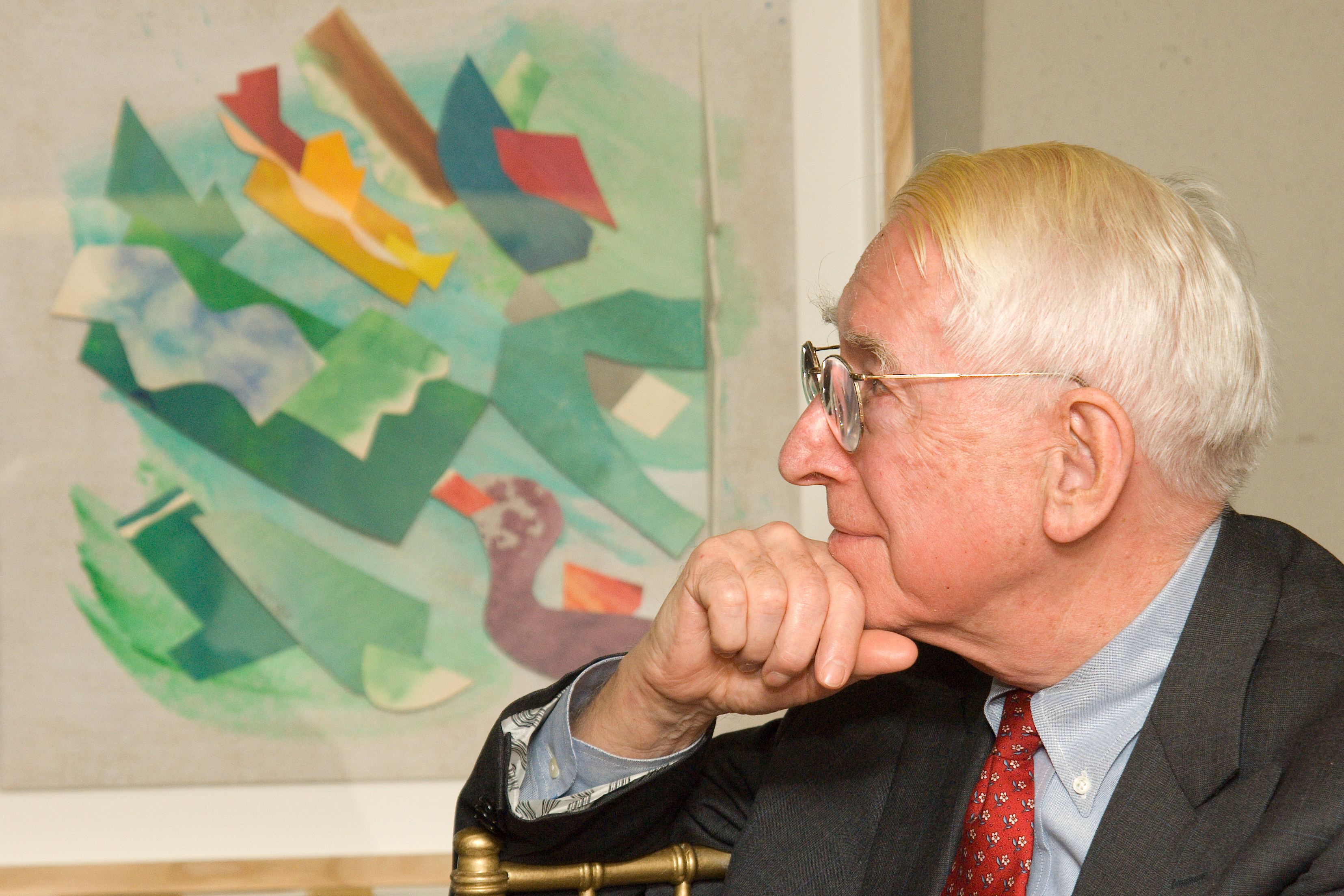 Dr. Brady in 2007 at the fifth anniversary celebration of the endowment of the Luther W. Brady Art Gallery, shown in front of a work by Sam Maitin, one of the artists included in the estate collection.