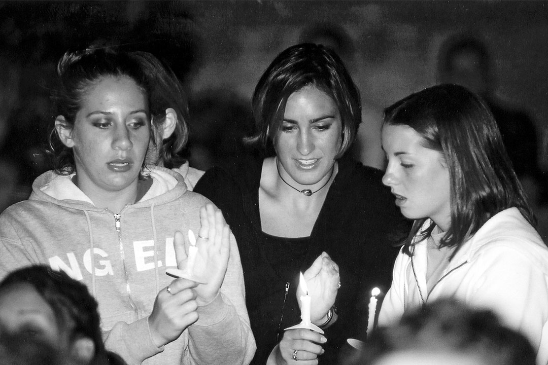 Students attend a candlelight vigil for 9/11