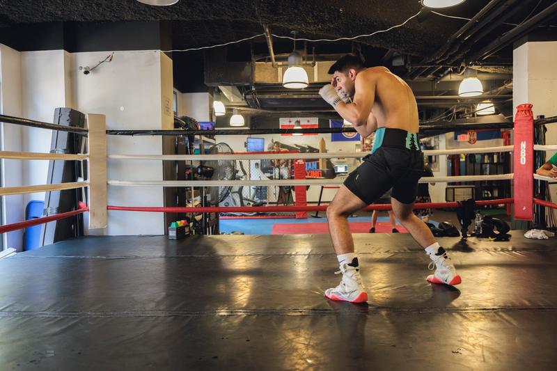 Man practices in a boxing ring