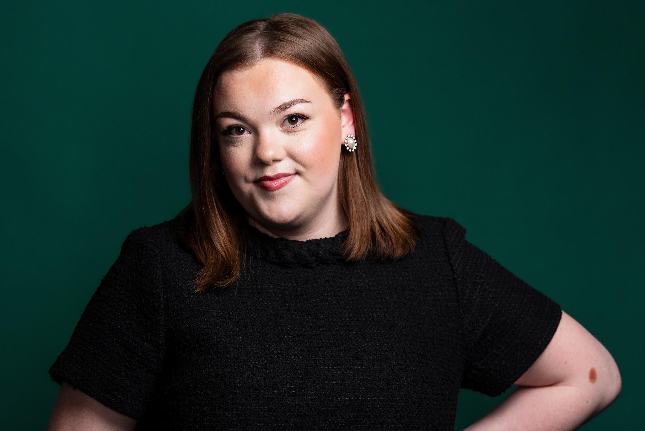 Maureen Rafter in black shirt with greeen background