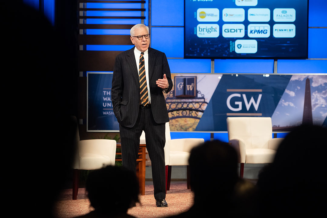 David Rubenstein talks to a George Washington University audience about artificial intelligence at a GW Business policy forum.