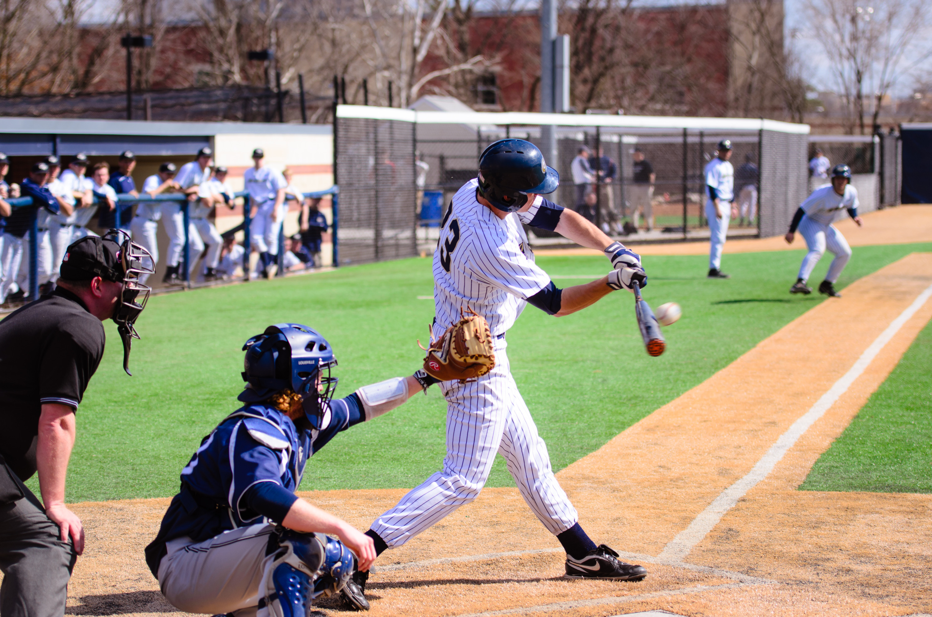 Kevin Mahala making contact with a baseball
