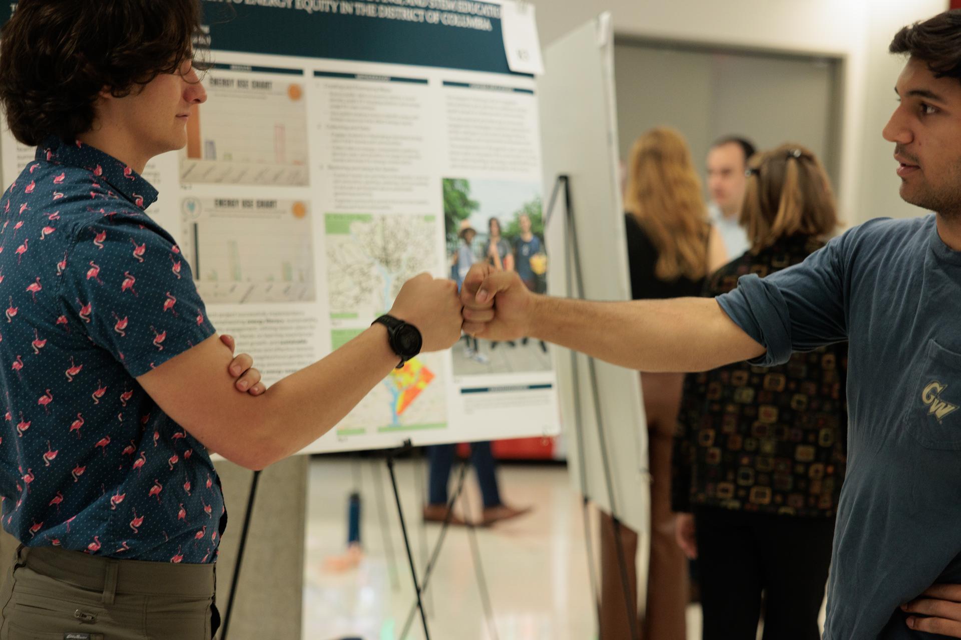 Eliot Hunter, left, worked on energy literacy with students in Anacostia. (William Atkins/GW Today)