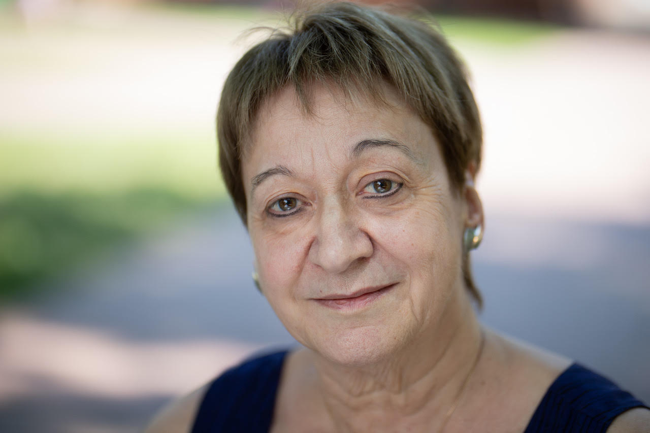 Professor of Physics Chryssa Kouveliotou with short brown hair looking at camera.
