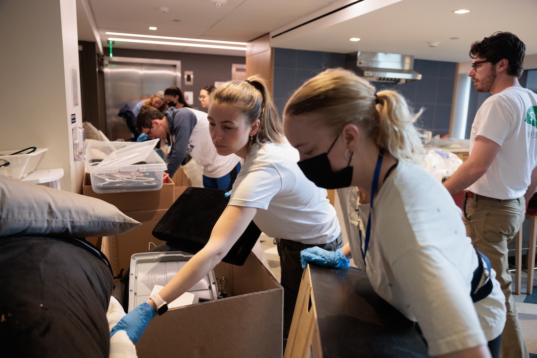Student volunteers sort through donated goods for reuse during Green Move-Out.