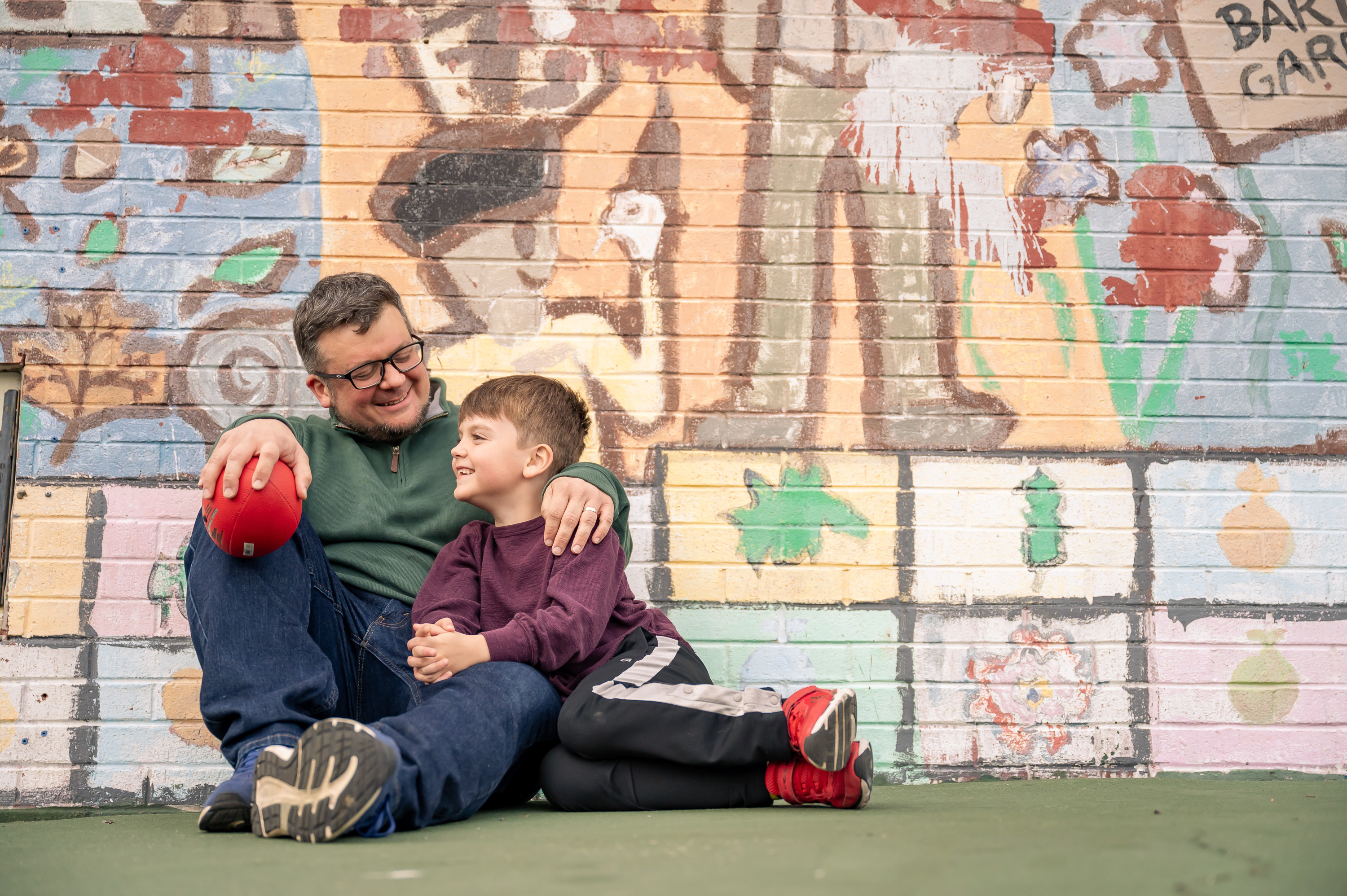 GW alumnus Joe Gidjunis talks with his son, Gabe.