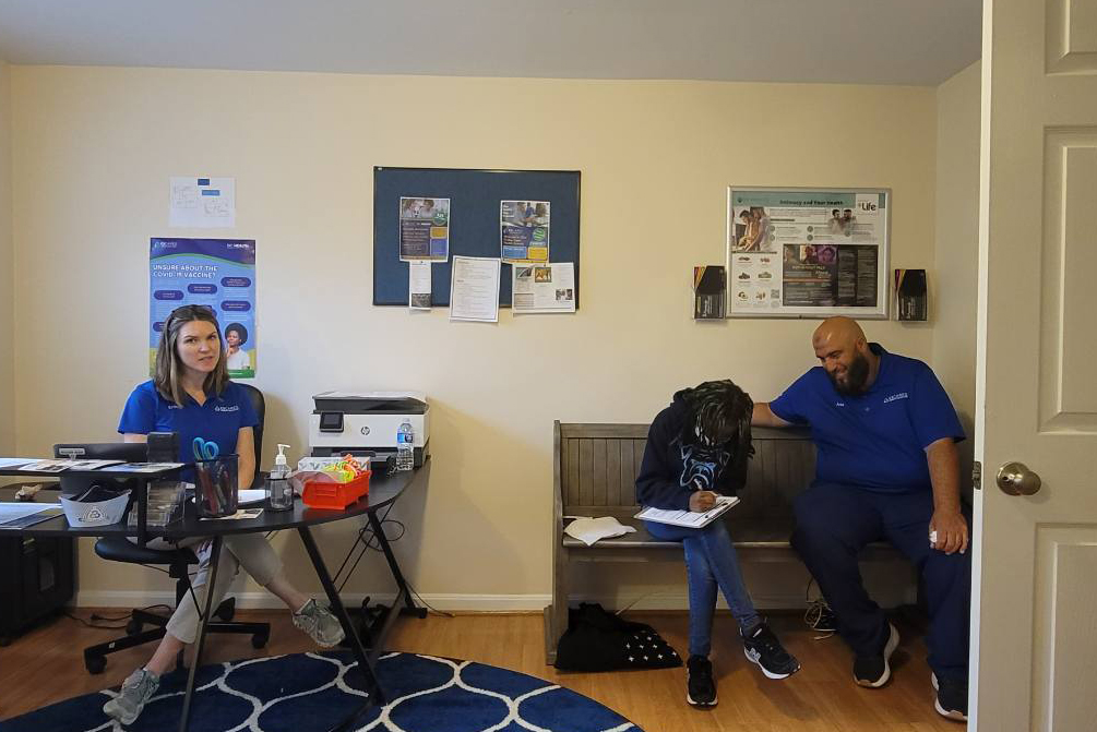 Erin Athey (left) with a community member and team member in one of the C3 Cares clinics. (Courtesy Erin Athey)
