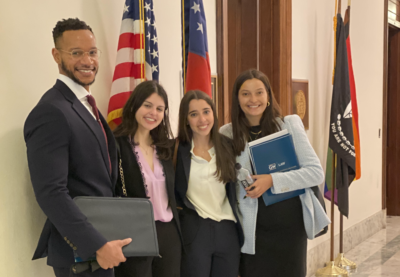 GW Law students Marcus Burden, Margo Schwartz, Abigail Holisher and Isabella Schwarze in a Congressional building on Capitol Hill