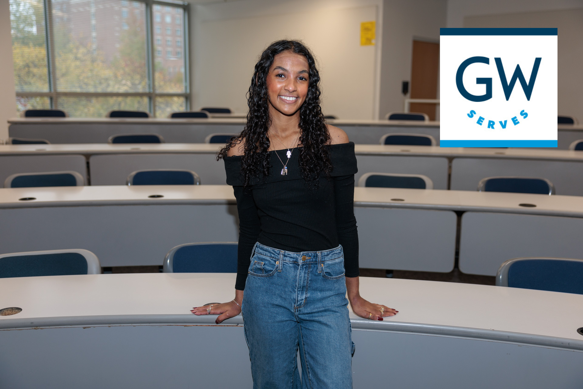 Student stands in classroom 