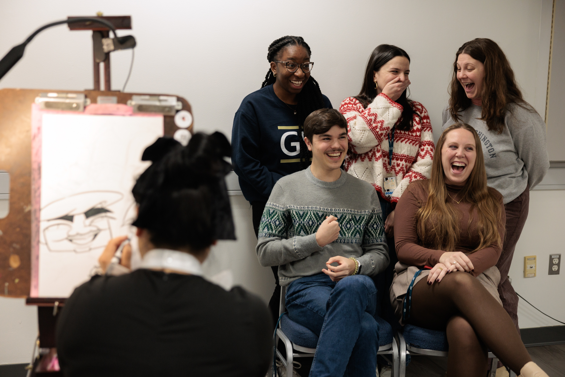 GW staff singing at the holiday celebration in 2024.
