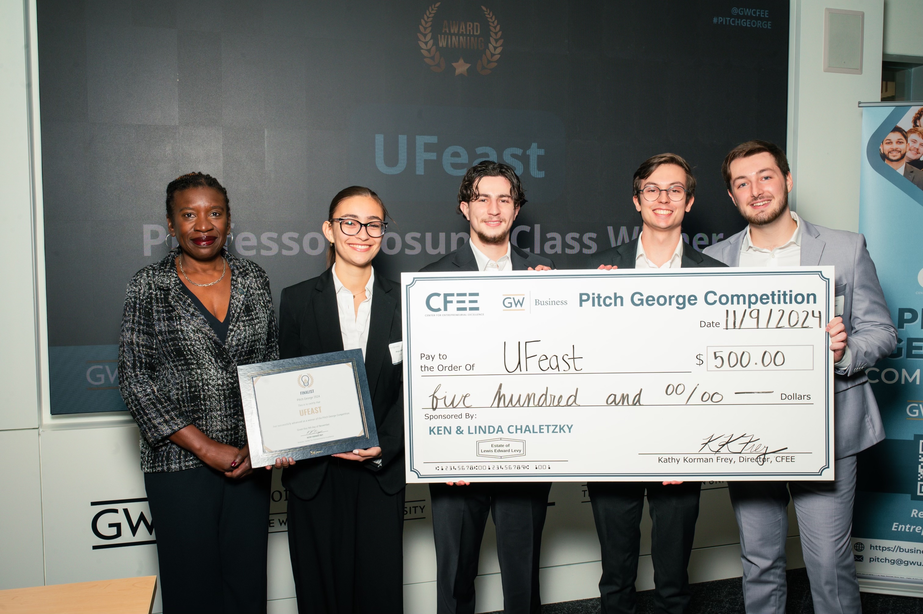 UFeast poses with a check