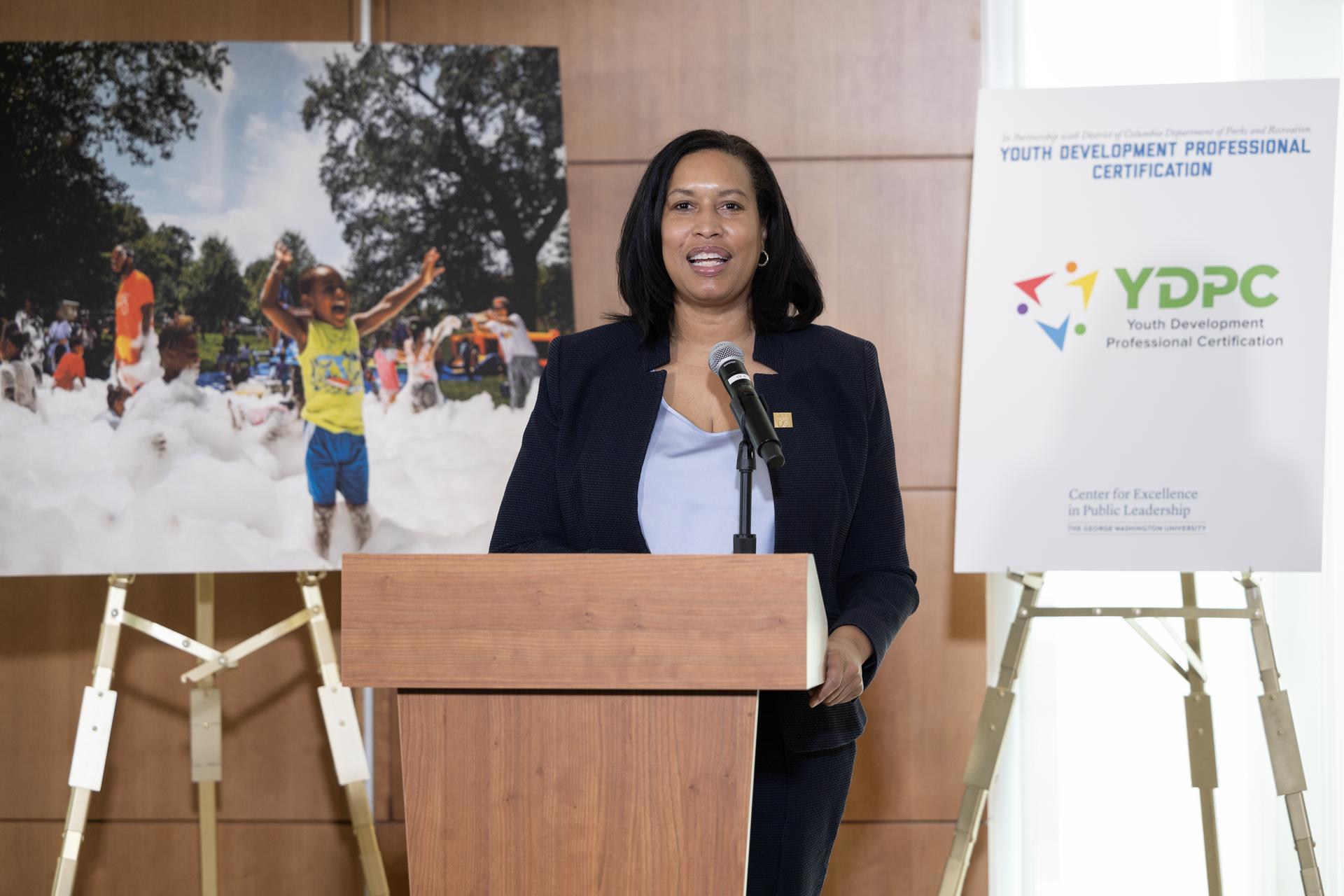 D.C. Mayor Muriel Bowser speaks at the podium