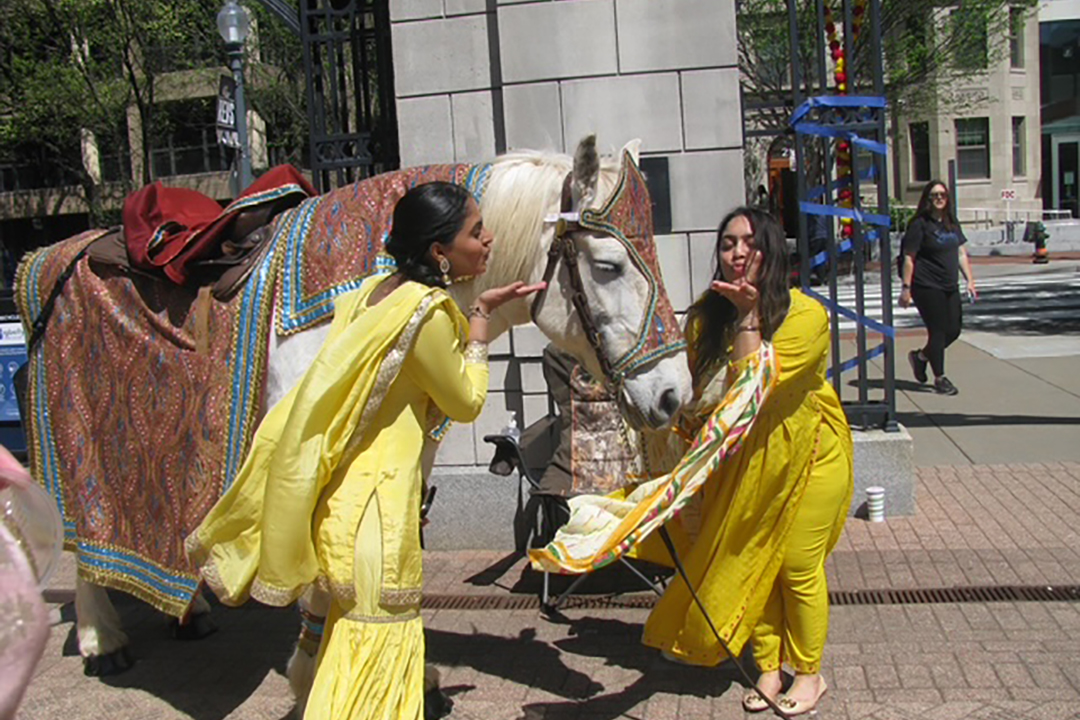 Simar Gill and Vaishnavi Vangani of the GW Sikh Student Association at last year's Punjab Day Mela. (Courtesy Simar Gill)