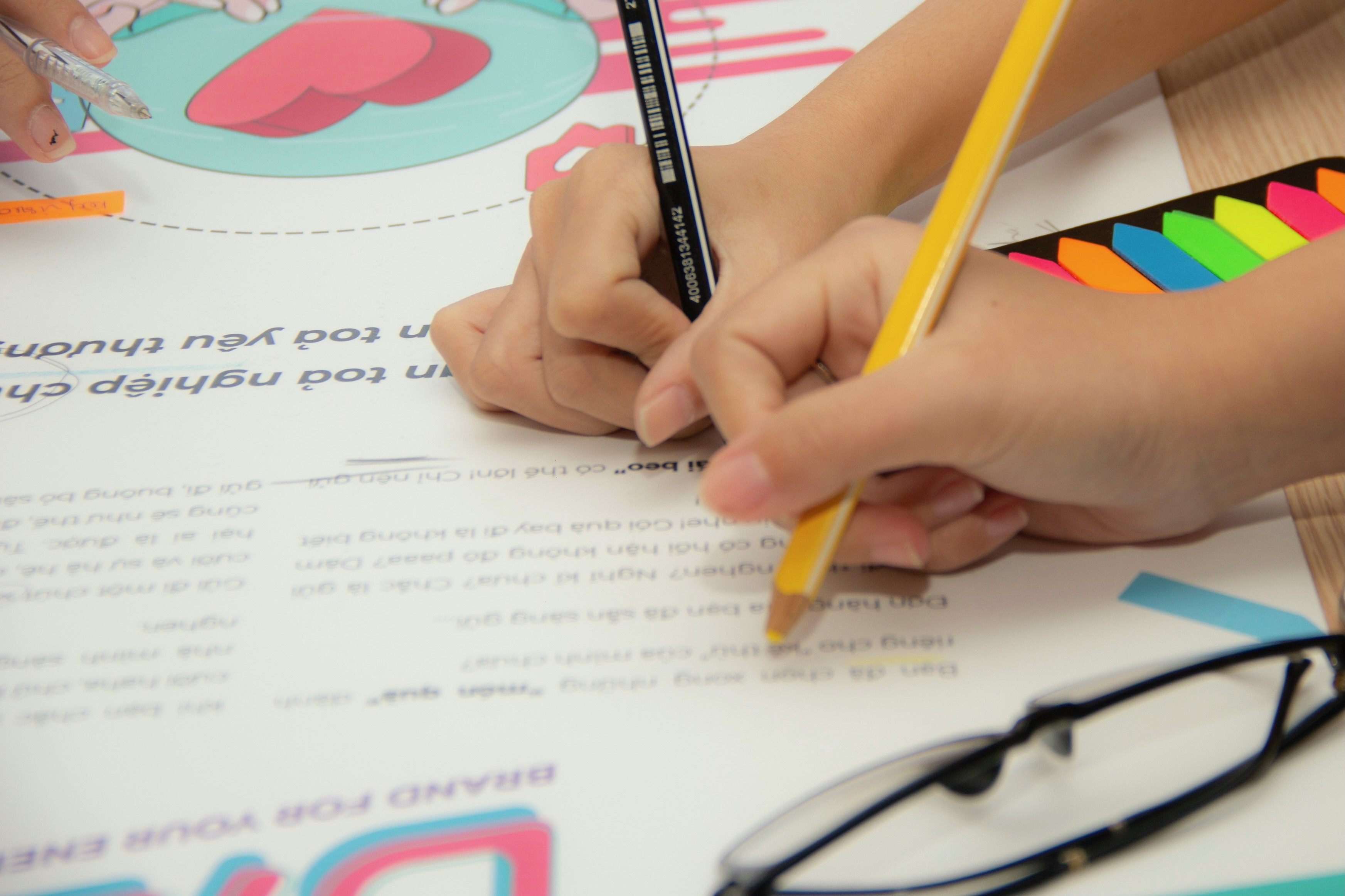 Image of students coloring in a classroom. 