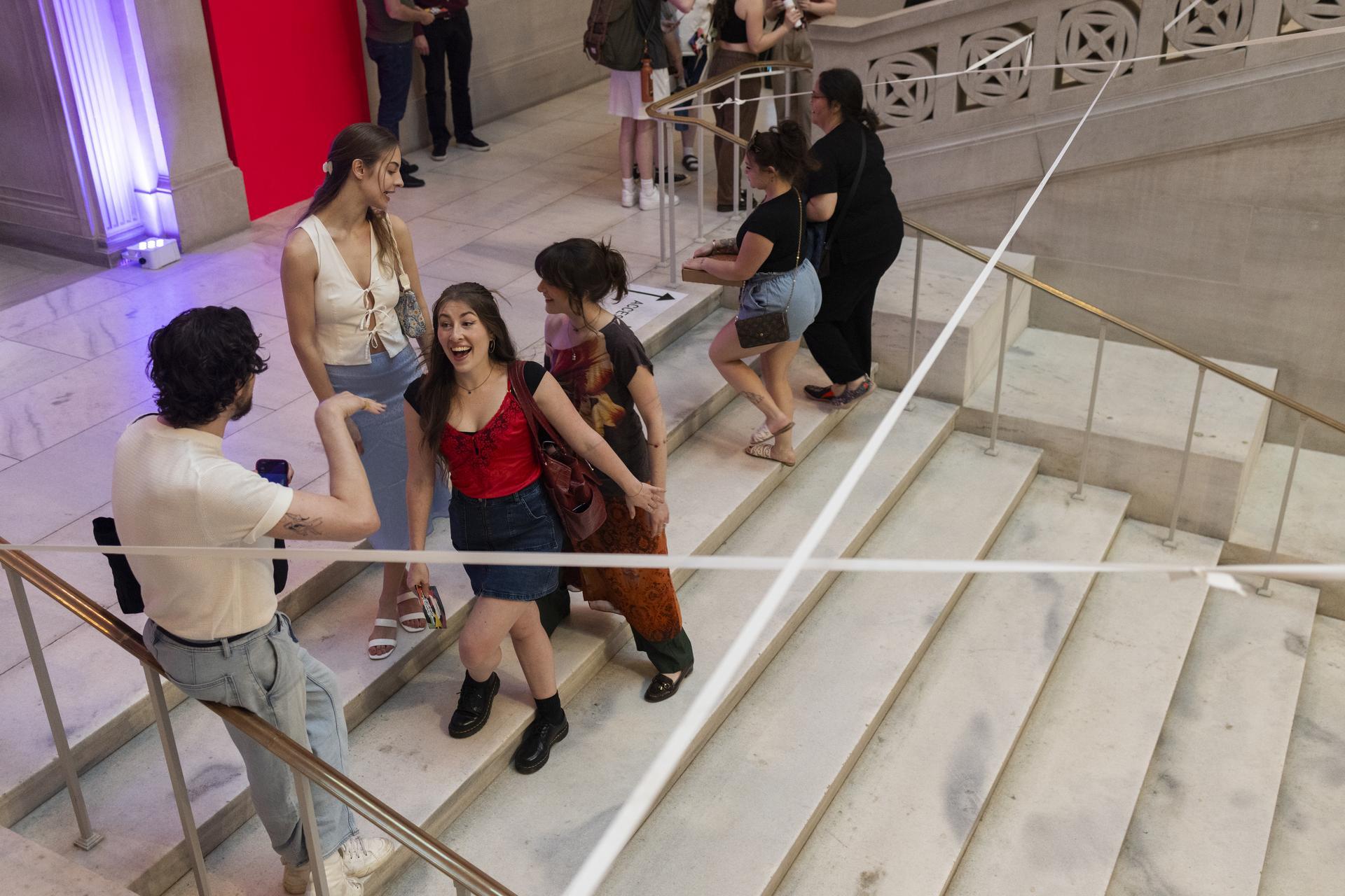 Photo: Cara Taylor Guests socialize on a Flagg Building staircase