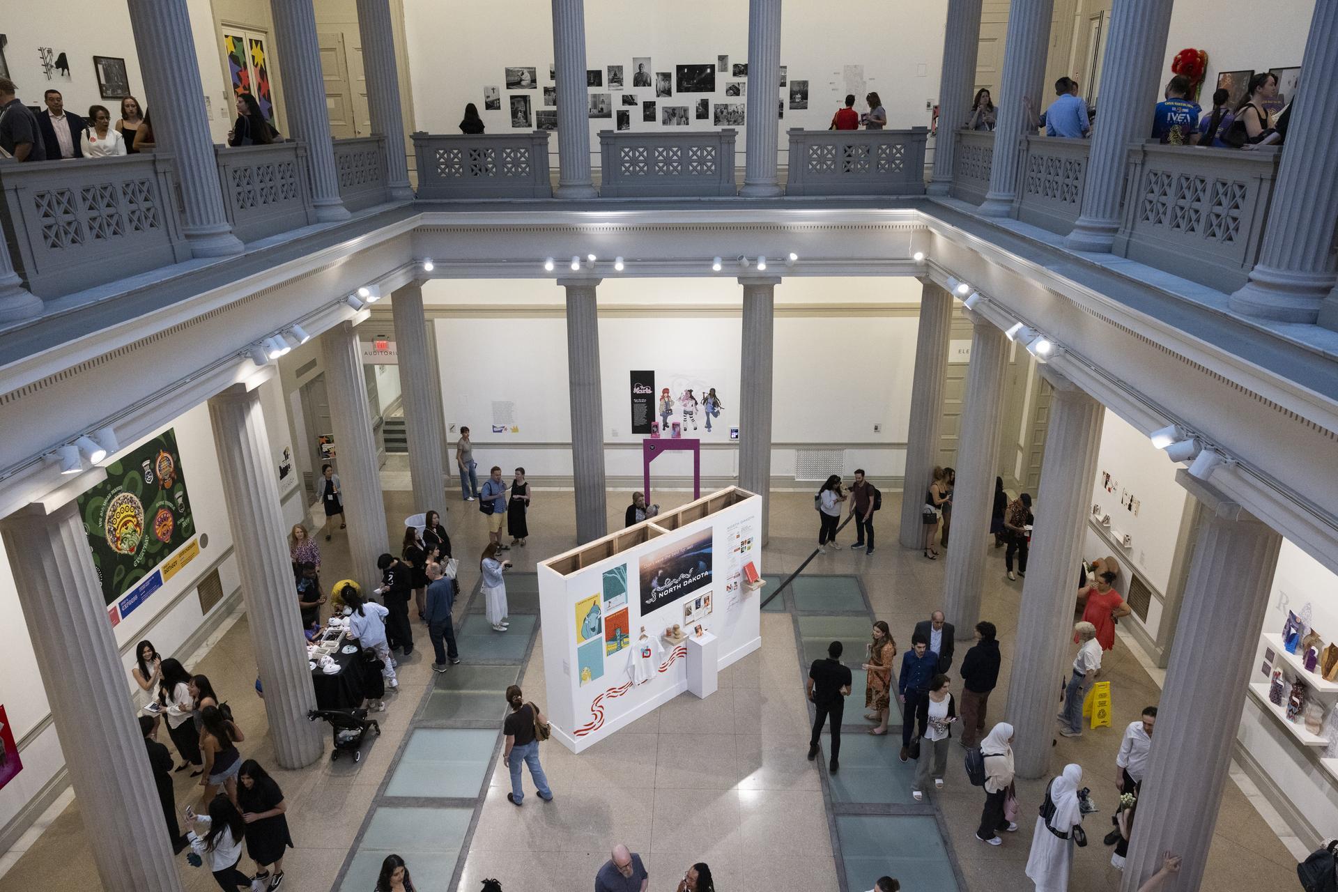 Party guests move through the Flagg Building Atrium seen from above