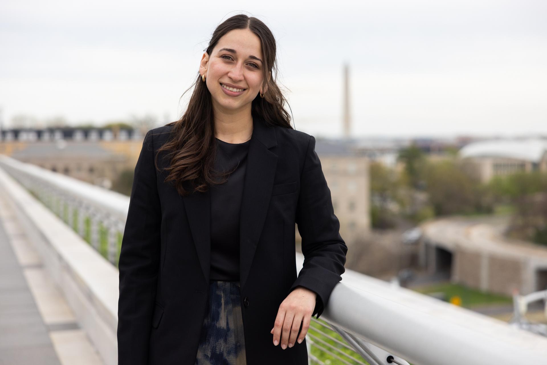 GW student speaker on top of Elliott School