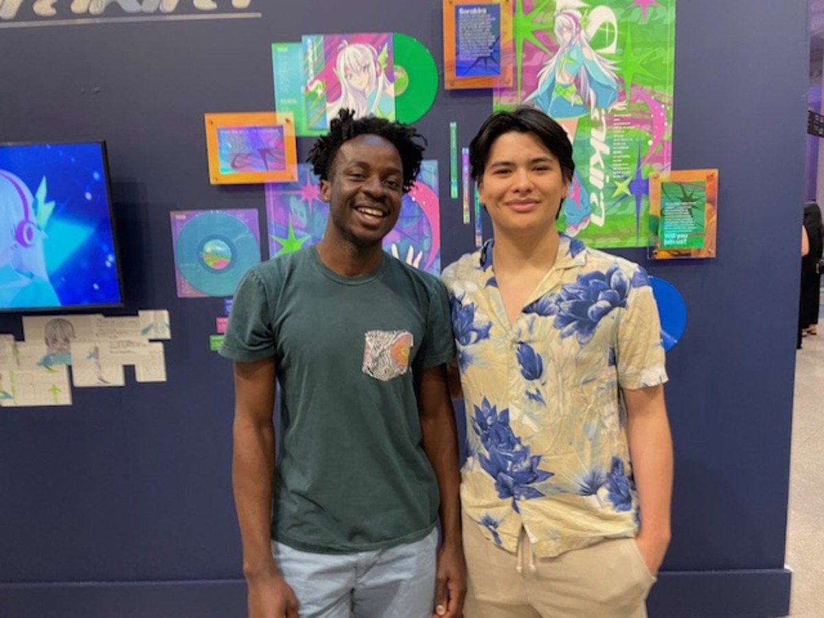 Fred Noubieptie, left, and Matias Liu Schmid admired the art Fred Noubieptie, left, and Matias Liu Schmid admired the art