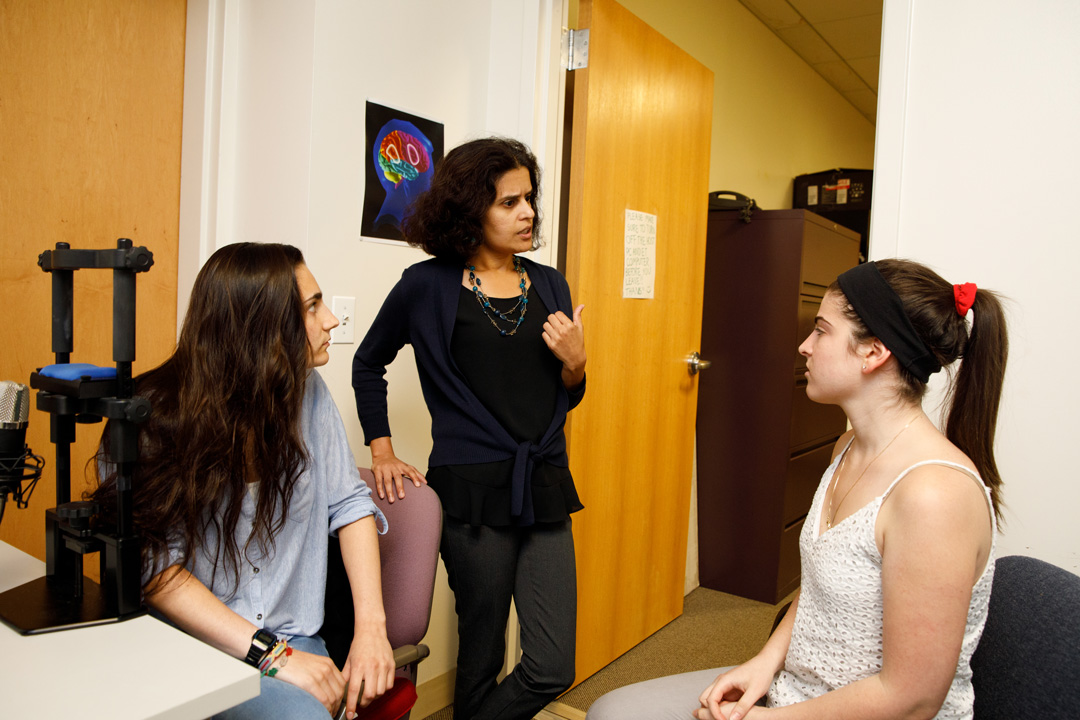 : Malathi Thothathiri (center with student researchers) 