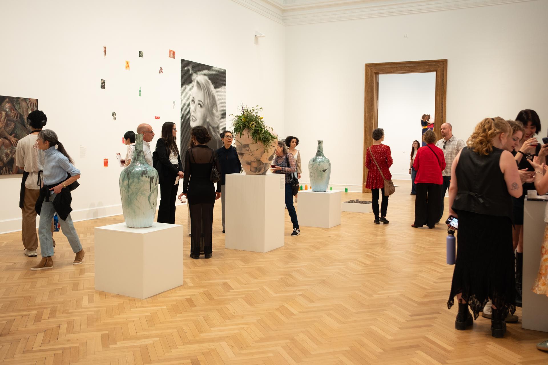 Photo: Jordan Tovin Guests roam in a Flagg Building gallery space