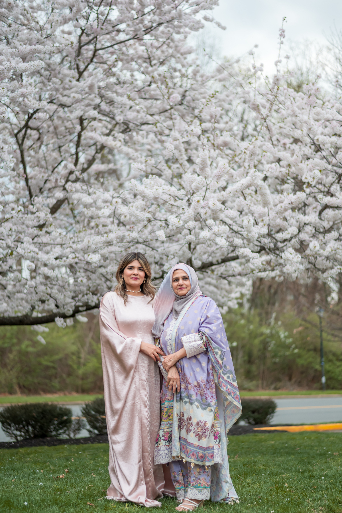 Javiera Ali and mother by a blossoming tree