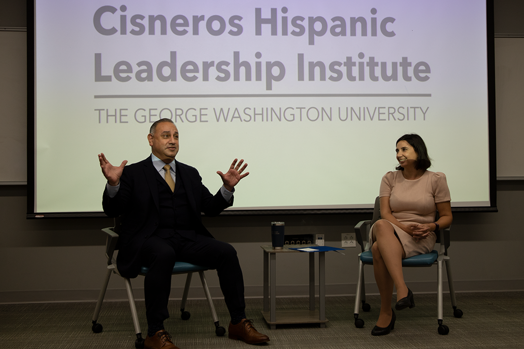 Gil Cisneros and Elizabeth Vaquera speaking at the annual welcome event for new Cisneros Scholars in 2022.