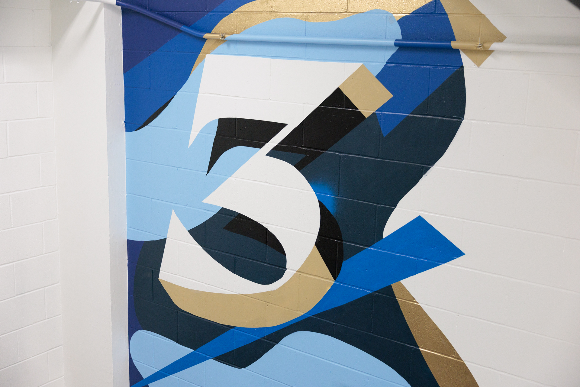 Stairwell art in USC with a huge numeral "3"