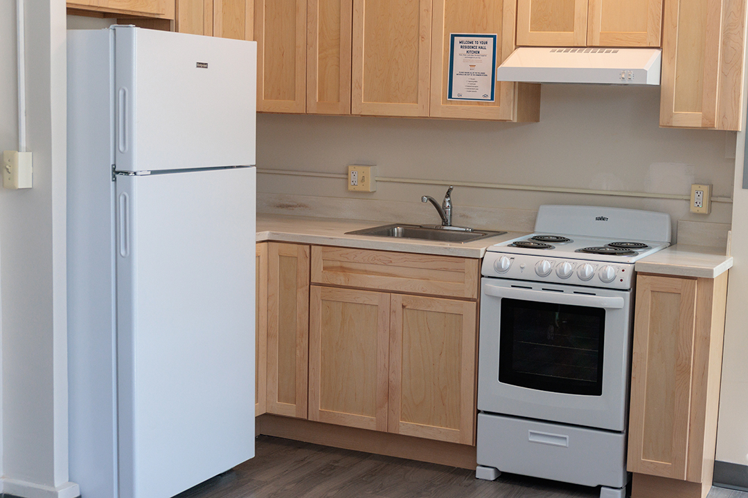 refrigerator, sink, stove and cupboards in FSK