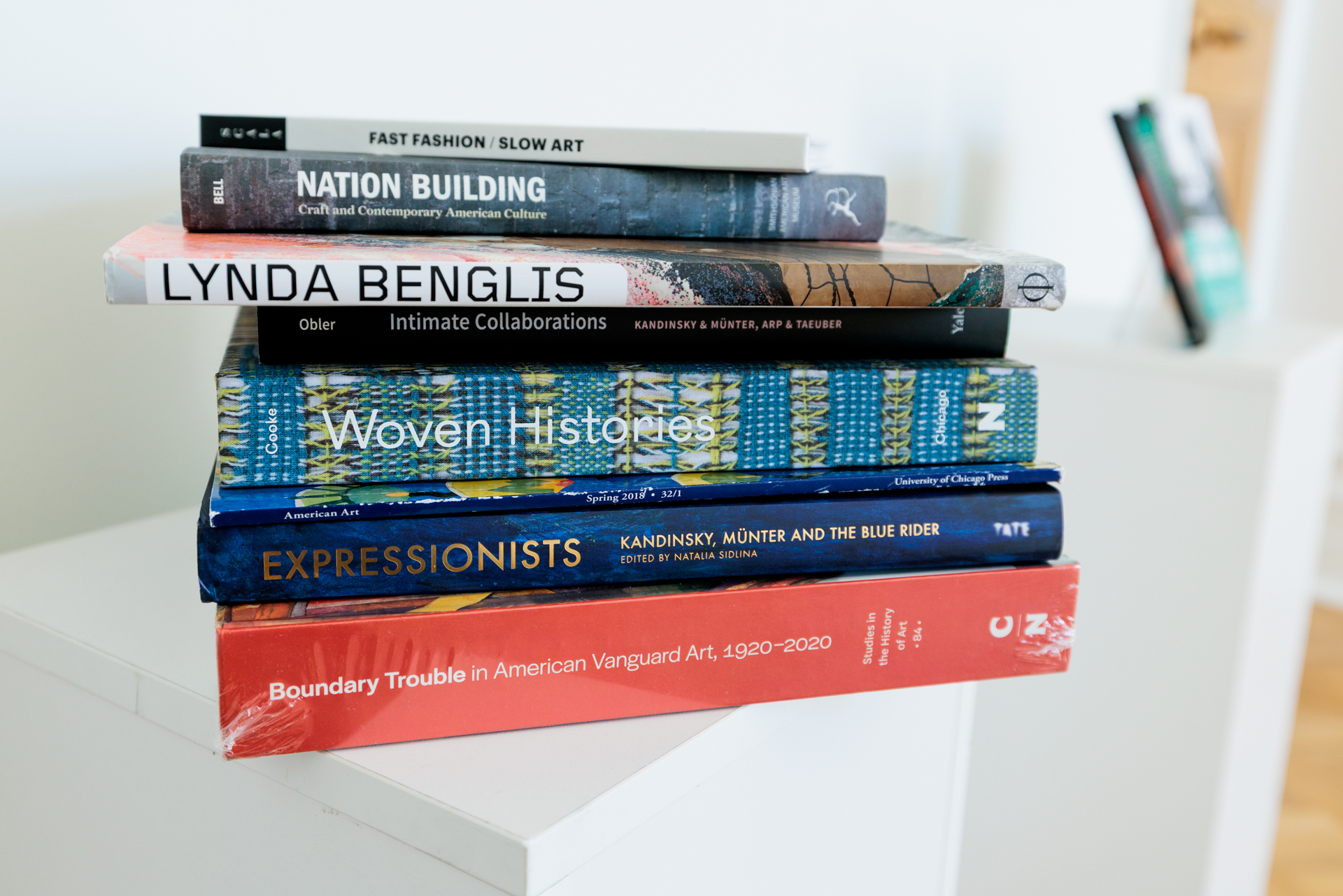 a stack of books and journals containing work by Bibi Obler a stack of books and journals containing work by Bibi Obler