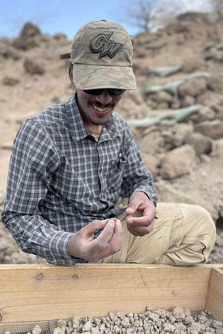 Postdoctoral scientist Niguss Baraki, Ph.D. ’25, examined stone artifacts at the Namorotukunan site.