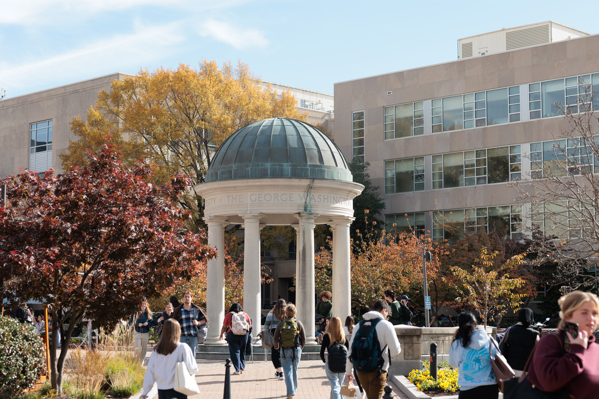 People walk across Kogan Plaza on a sunny fall day